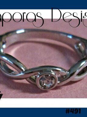 Silver Tone Size 5 Infinity Design Ring With Clear Crystal